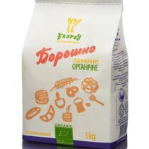 White bag of organic flour labeled 'борошно' with wheat icons and green Organic logo, 1 kg shown on the purple base.