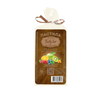 Loaf of bread in a clear bag with a brown label and a brown ribbon tied at the top.