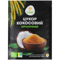 Package of organic coconut sugar featuring a sliced coconut and a bowl of brown sugar on a black bag.
