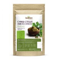 Kraft paper pouch with a white label showing Ukrainian text for 'Khmeli suneli' spice mix and a bowl of ground spice with greens on the label, product packaging.