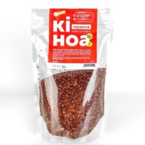 Clear stand-up pouch filled with red quinoa, sealed at the top with a bright red label displaying white text.