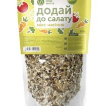 Bag of salad seed mix with sesame and flax seeds on a bright yellow label; packaging text in Ukrainian reads 'Add to salad'